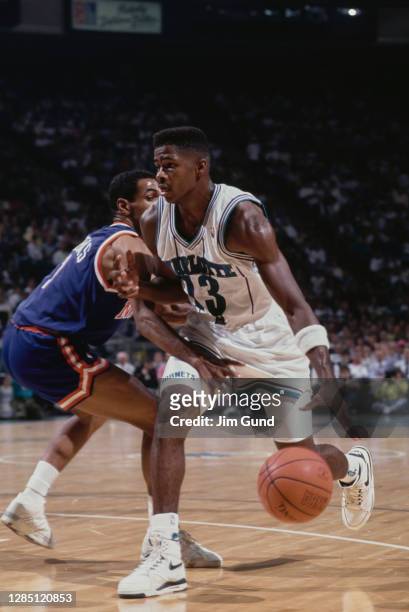 Kendall Gill, Small Forward for the Charlotte Hornets dribbles the basketball around Maurice Cheeks of the New York Knicks during their NBA Central...