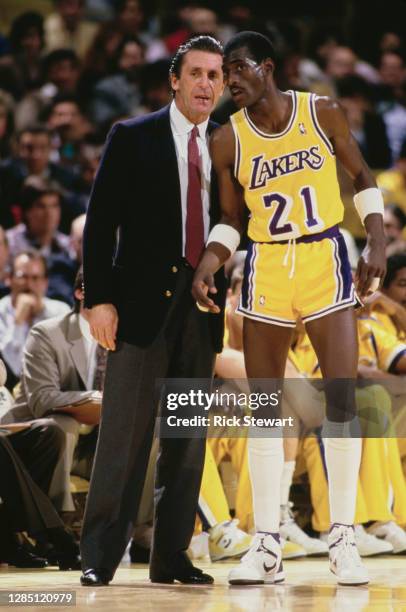 Michael Cooper, Shooting Guard for the Los Angeles Lakers listens to instructions from Head Coach Pat Riley during the NBA Pacific Division...