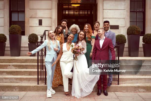 lesbian wedding with friends - wedding guests stockfoto's en -beelden