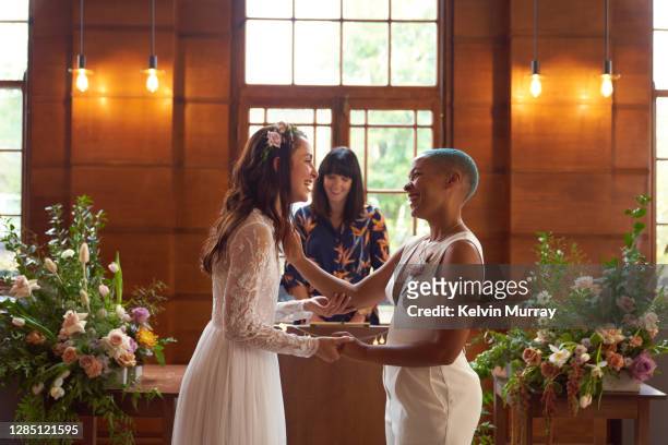 lesbian same sex wedding - marriage equality stock pictures, royalty-free photos & images