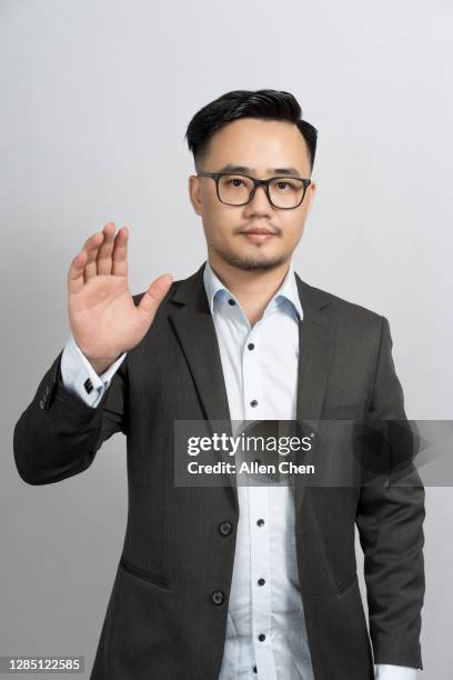 asian men in suits are tidying up - cuff link stock pictures, royalty-free photos & images