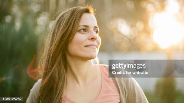 middle age woman portrait - hispanic woman looking away stock pictures, royalty-free photos & images