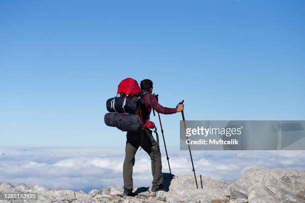 hiker looking at mountain - altitude sickness stock pictures, royalty-free photos & images