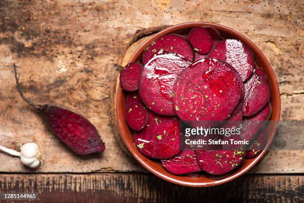 beetroot salad with parsley in a bowl - root vegetables stock pictures, royalty-free photos & images