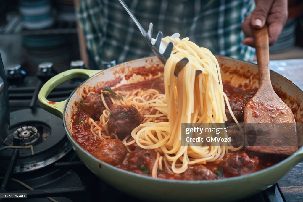 Preparing Meatballs with Spaghettis Tomato Sauce in a Pan