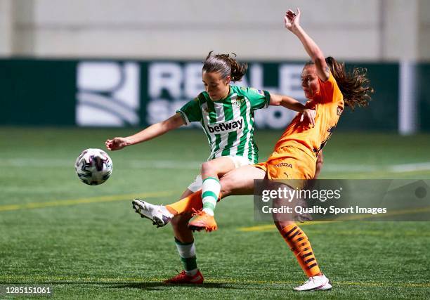Rosa Marquez of Real Betis competes for the ball with Flor Bosegundo of Valencia CF during the Primera Division Feminina match between Real Betis and...