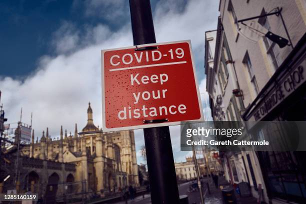 Sign indicates keeping a safe distance on November 10, 2020 in Cambridge, England. England entered a second national coronavirus lockdown on 5th...