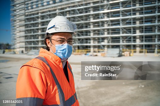 Portrait Of Engineer Wearing Protective Face Mask Inside The ...