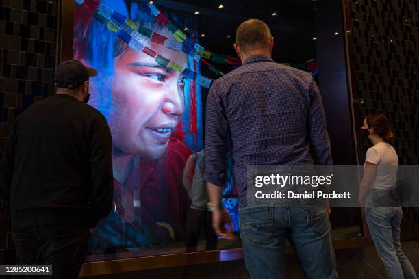 People observe art in the new 'artcade' in West Side Place arcade on November 12, 2020 in Melbourne, Australia. The arcade in Melbourne's CBD has...