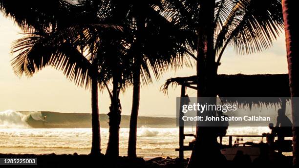 indonesia, surfing in the hinako islands - hinako islands stock pictures, royalty-free photos & images