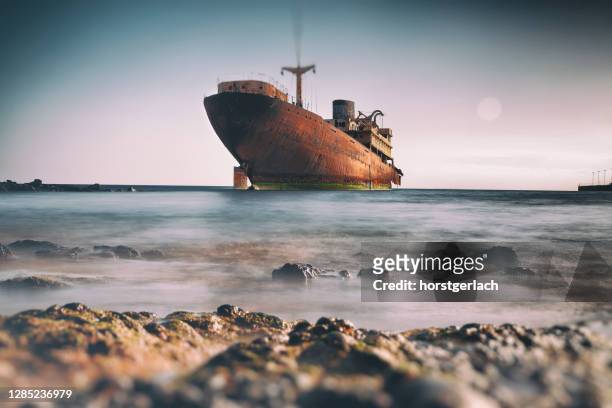 shipwreck at lanzarote, canary islands, spain - boat ruins stock pictures, royalty-free photos & images