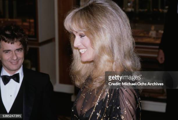 British actor, comedian and pianist Dudley Moore and American actress and singer Susan Anton attend the 40th Annual Golden Globe Awards, held at the...