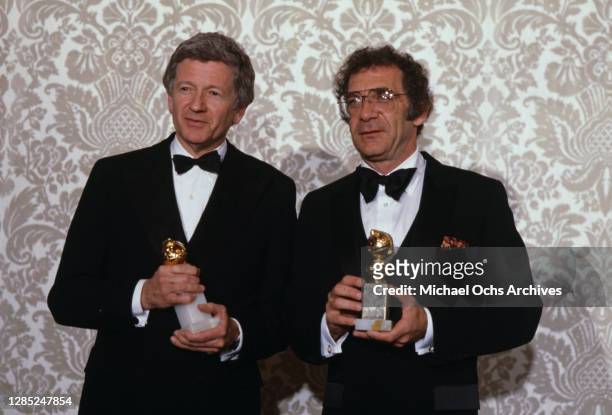 American film producer Dick Richards and American film director and producer Sydney Pollack attend the 40th Annual Golden Globe Awards, held at the...