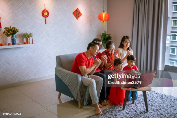 video call with family member on chinese new year during pandemic - chinese prepare for lunar new year stock pictures, royalty-free photos & images