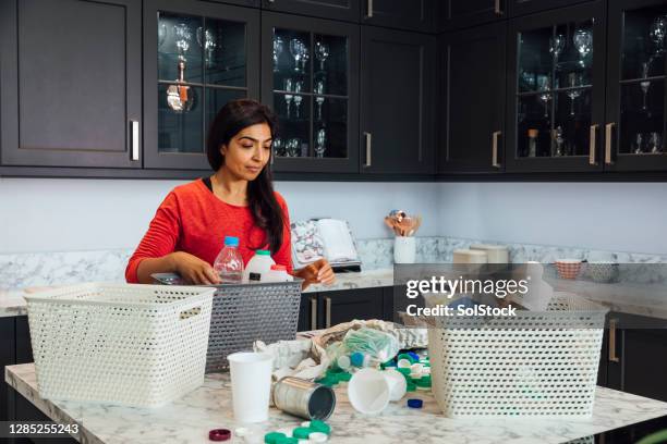 To Sort Out Sorting Recycling At Home Photos and Premium High Res Pictures - Getty ...