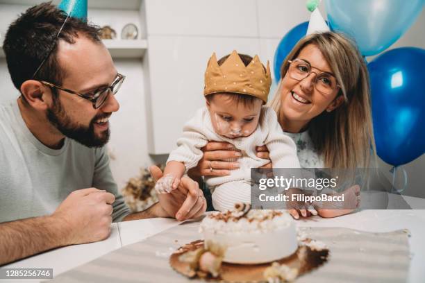 happy family celebrating the baby's first 6 months together - children funny moments stock pictures, royalty-free photos & images