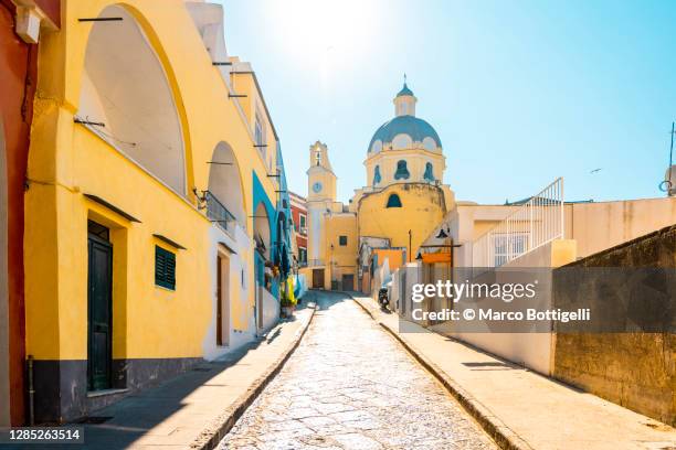 city street to santa maria delle grazie church, procida island, italy. - milan italy stockfoto's en -beelden