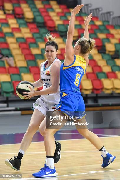 Stephanie Blicavs of the Flyers controls the ball in front of Cassidy McLean of the Spirit during the round one WNBL match between the Bendigo Spirit...