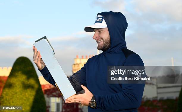 Tyrrell Hatton of England wearing his hoodie and holding the winners trophy after the final round of the BMW PGA Championship at Wentworth Golf Club...