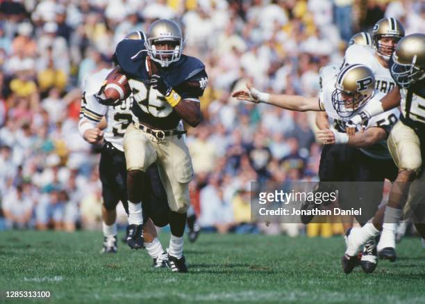 Raghib Ismail, Wide Receiver for the Notre Dame Fighting Irish runs the football during the NCAA Big Ten Conference college football game against the...