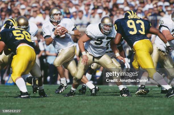 Ron Powlus, Quarterback for the Notre Dame Fighting prepares to throw the football out of the pocket during the NCAA Division I-A Big 10 college...