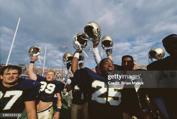 Raghib Ismail, Wide Receiver for the Notre Dame Fighting Irish celebrates with his team mates after winning the NCAA Big Ten Conference college...