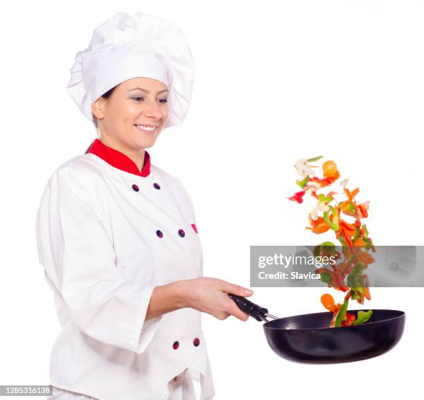 female chef cooking - throwing food stock pictures, royalty-free photos & images