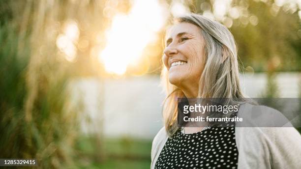senior woman portrait - content stock pictures, royalty-free photos & images