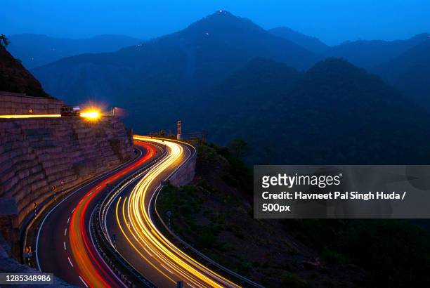 high angle view of light trails on road at twilight,himachal pradesh,india - himachal pradesh stock pictures, royalty-free photos & images