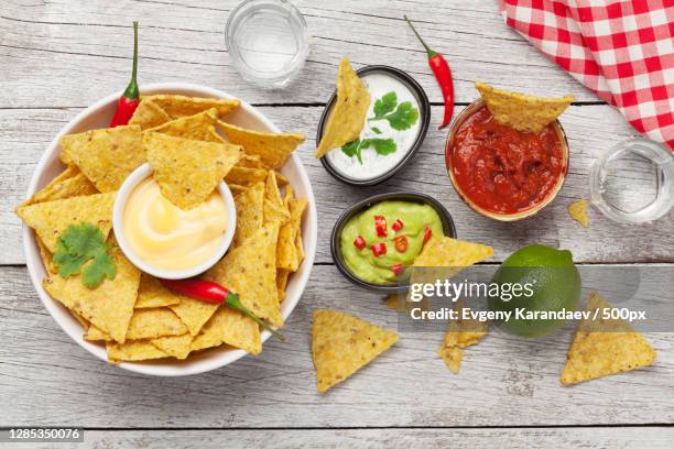 directly above shot of nachos on table - tortilla chip stock-fotos und bilder