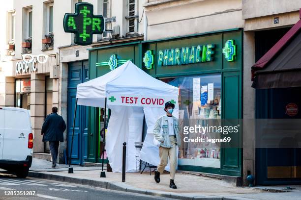 deployment of covid-19 antigenic testing by pharmacists, in paris - france coronavirus stock pictures, royalty-free photos & images