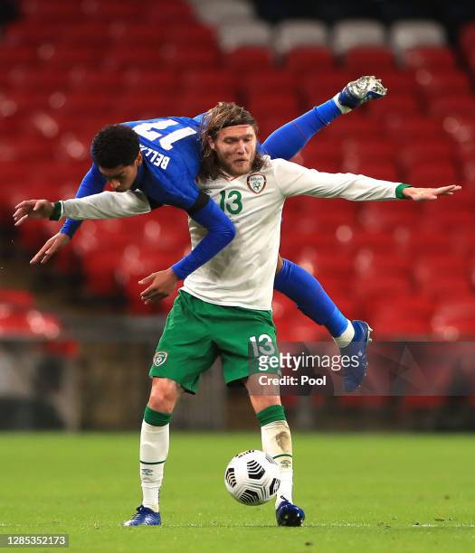 Jude Bellingham of England collides with Jeff Hendrick of Republic of Ireland during the international friendly match between England and the...