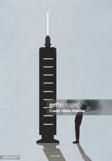 silhouette of man standing below large vaccine syringe - boy standing side view stock illustrations