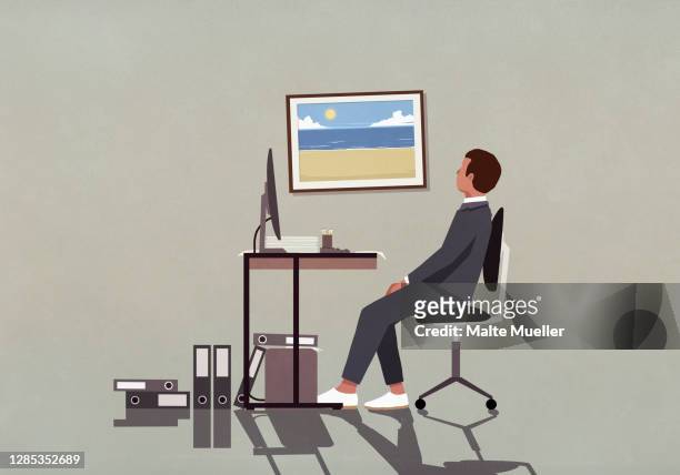 stockillustraties, clipart, cartoons en iconen met businessman at office desk looking at photograph of beach on wall - office desk