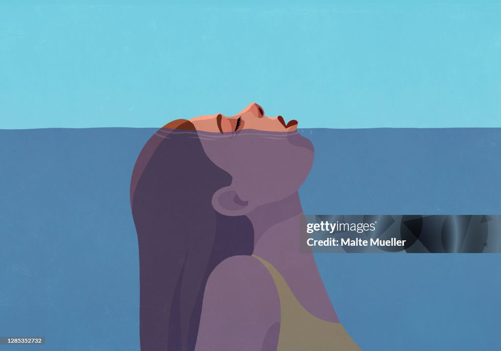 Woman gasping for air above water