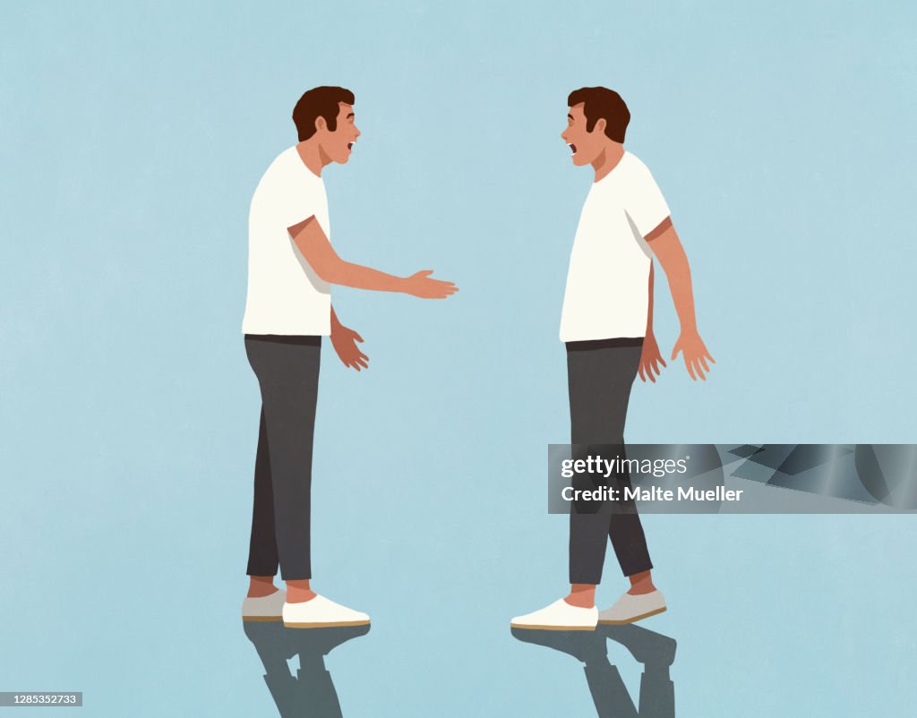 Surprised twin brothers face to face