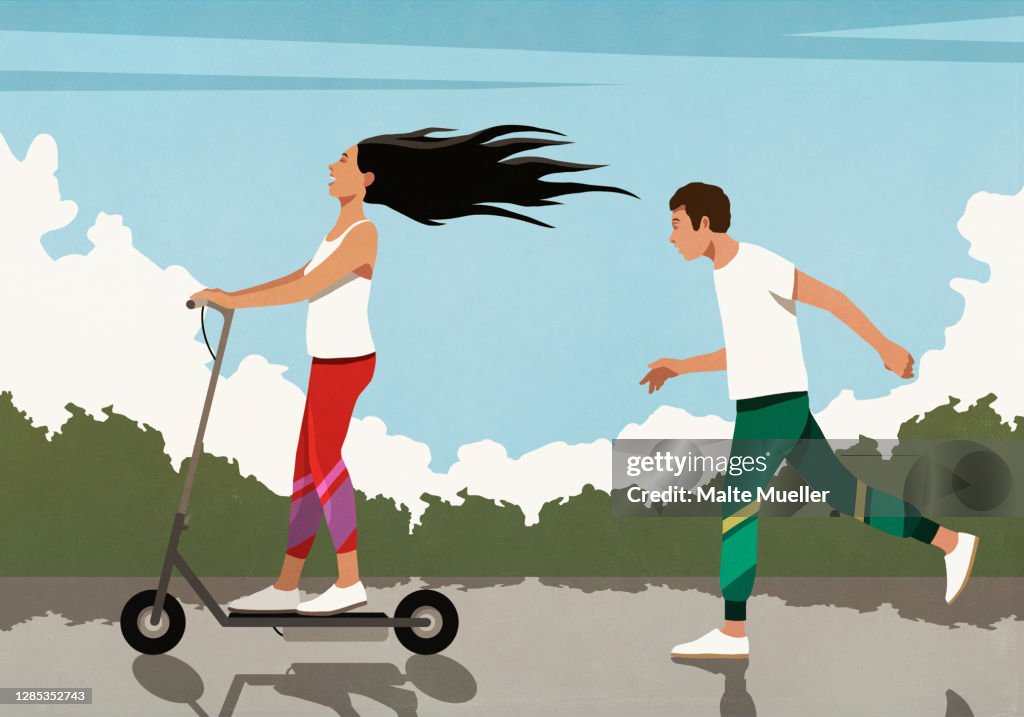 Man running behind carefree girlfriend on electric scooter
