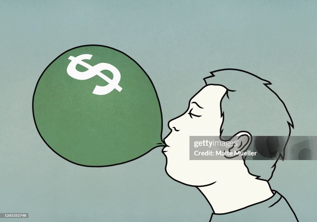 Man inflating dollar sign balloon