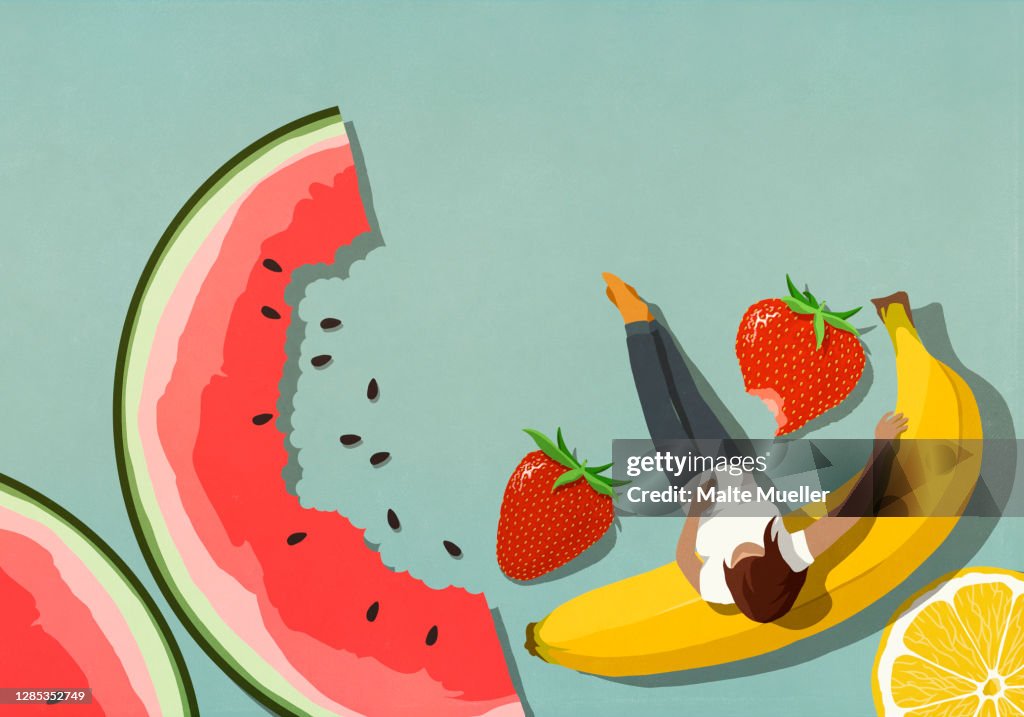 Woman relaxing among fruit