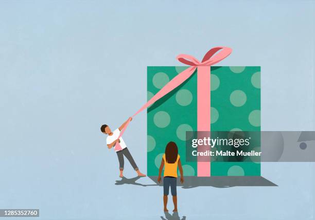 woman watching husband open large gift - anticipation stock illustrations