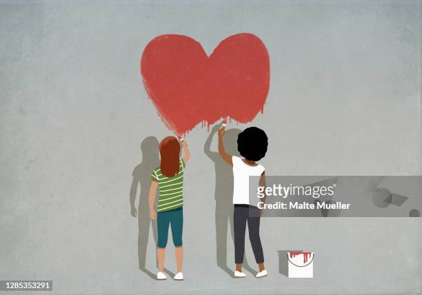multiethnic girls painting red heart on wall - best friends kids stock illustrations