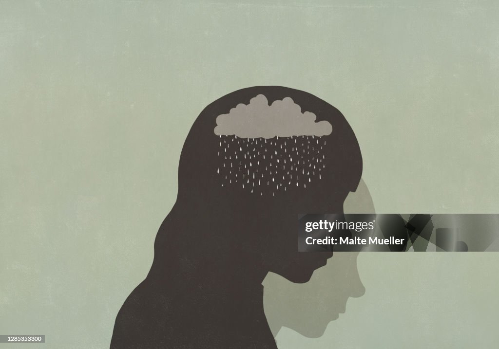 Silhouette sad woman with rain clouds in head