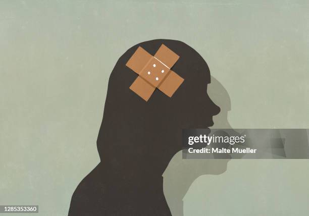 silhouette woman with bandage over head - low self esteem stock illustrations