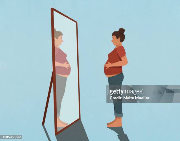 pregnant young woman looking at reflection in mirror - gesundheitsbewußt stock-grafiken, -clipart, -cartoons und -symbole