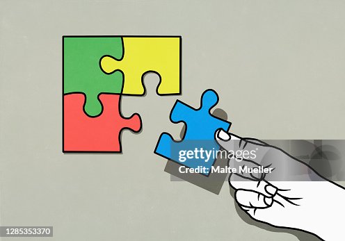 Hand completing puzzle with missing piece Hand completing puzzle with missing piece
