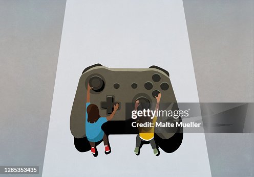 Boy and girl playing at large video game controller Boy and girl playing at large video game controller