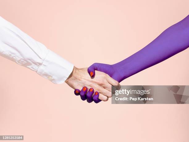 abstract handshake on pink background - handshake abstract stock pictures, royalty-free photos & images