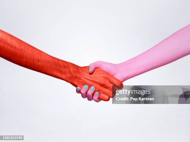 pink and red handshake - handshake abstract stock pictures, royalty-free photos & images