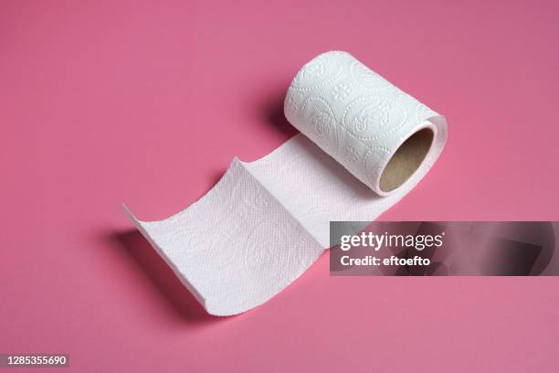 white toilet paper roll with  on pink background - no toilet paper stock pictures, royalty-free photos & images