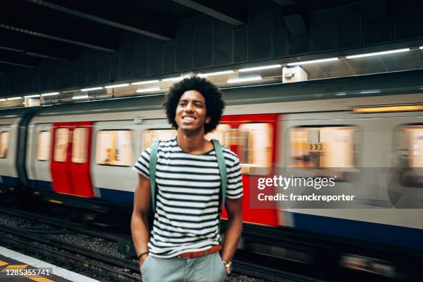 man waiting the train at the station - london underground speed stock pictures, royalty-free photos & images